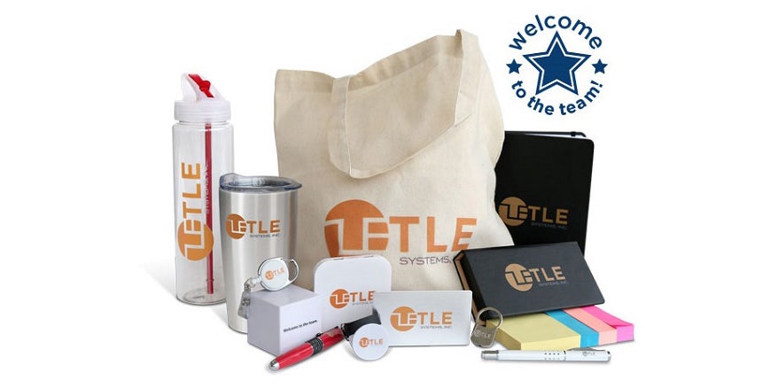 Welcome kit featuring a cream canvas bag with orange logo surrounded by other promotional items