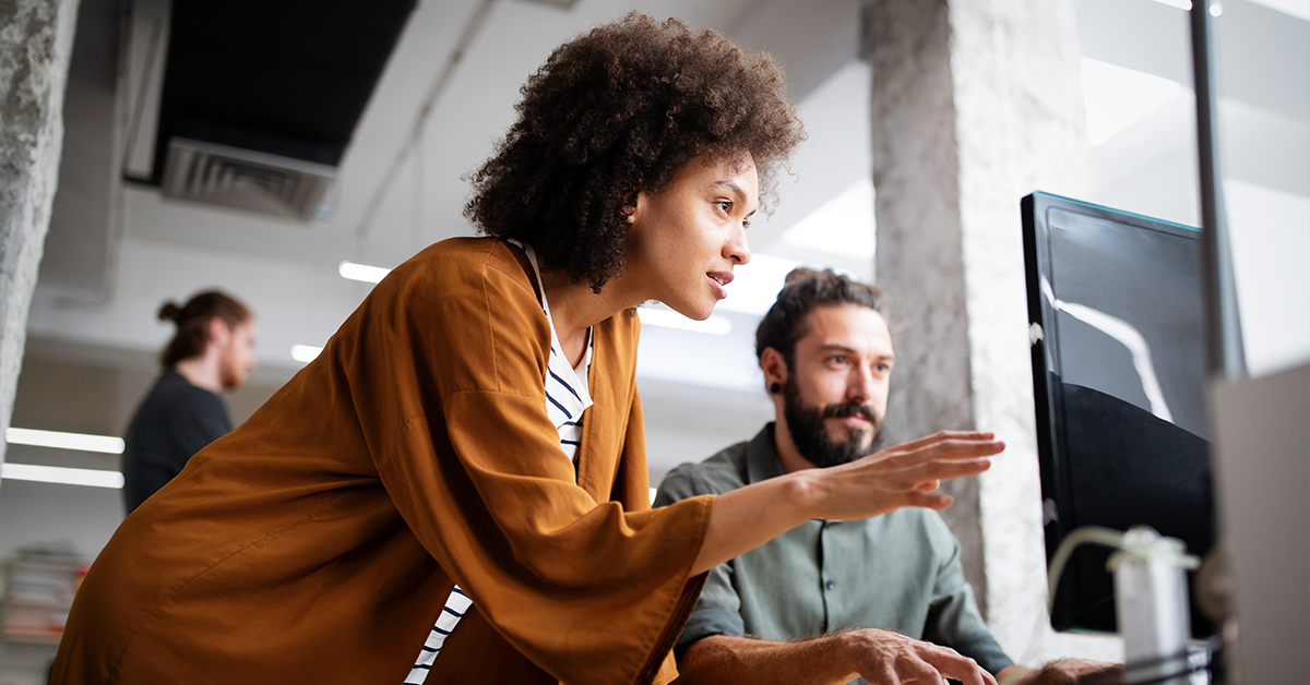 new hire being mentored at computer