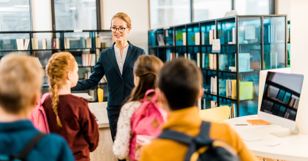 librarian working with kids in library